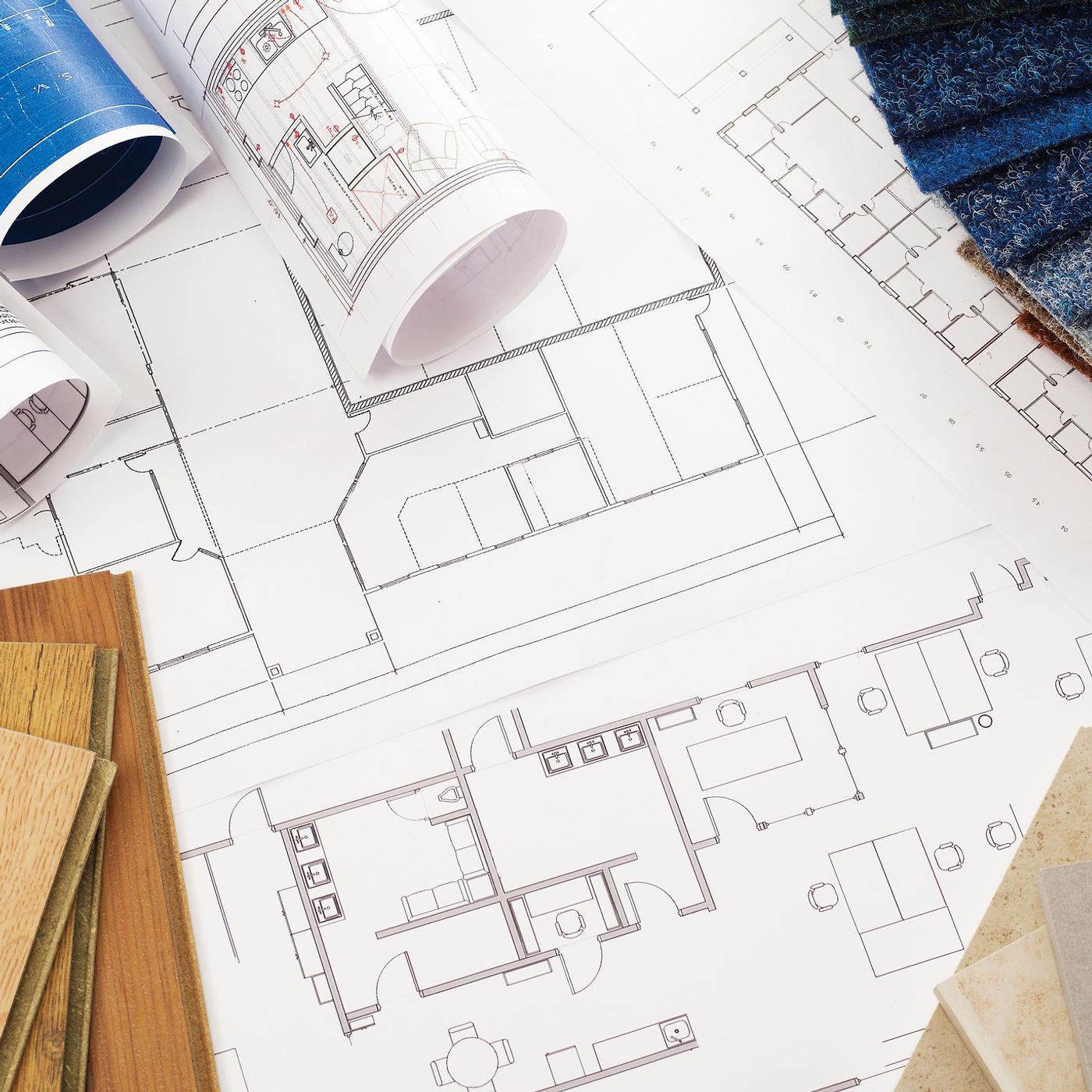 Architectural blueprints and material samples — Berm Inc. pre-construction planning