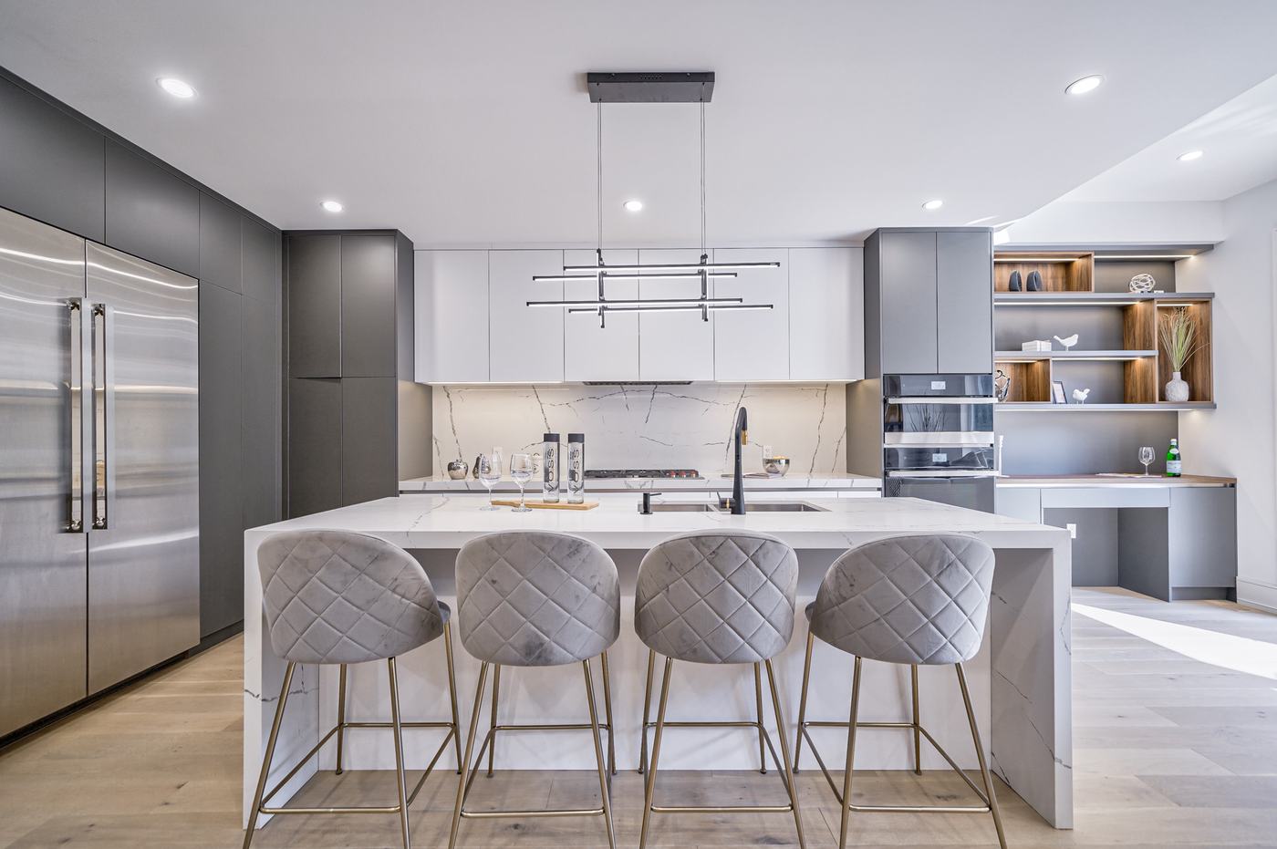 Custom kitchen with central island and bar seating — Berm Inc. project photo