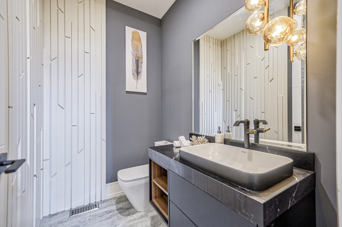 Contemporary powder room with vessel sink and textured wall — Berm Inc. project photo