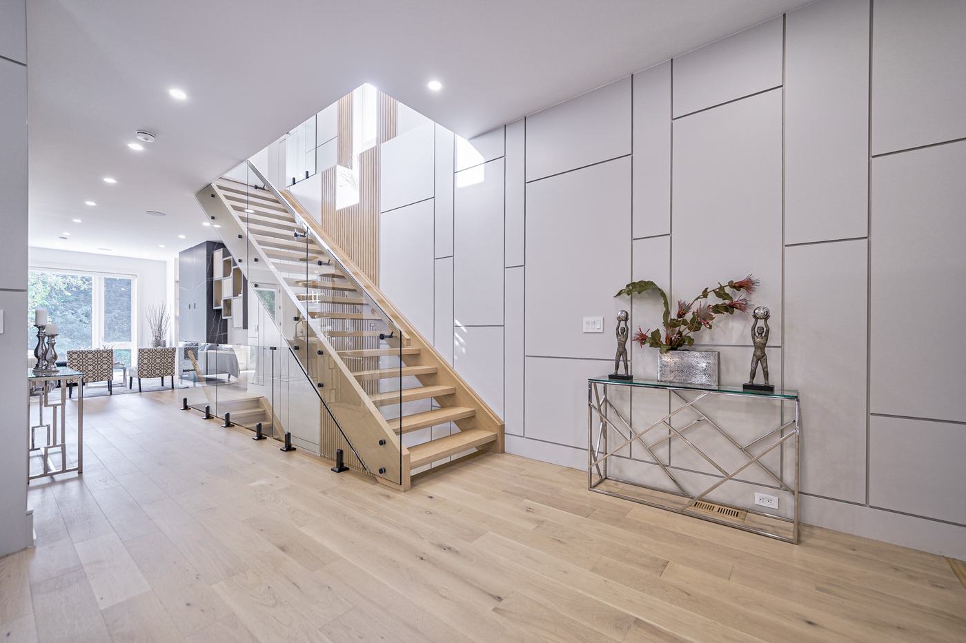 Foyer with open staircase and glass railing — Berm Inc. project photo