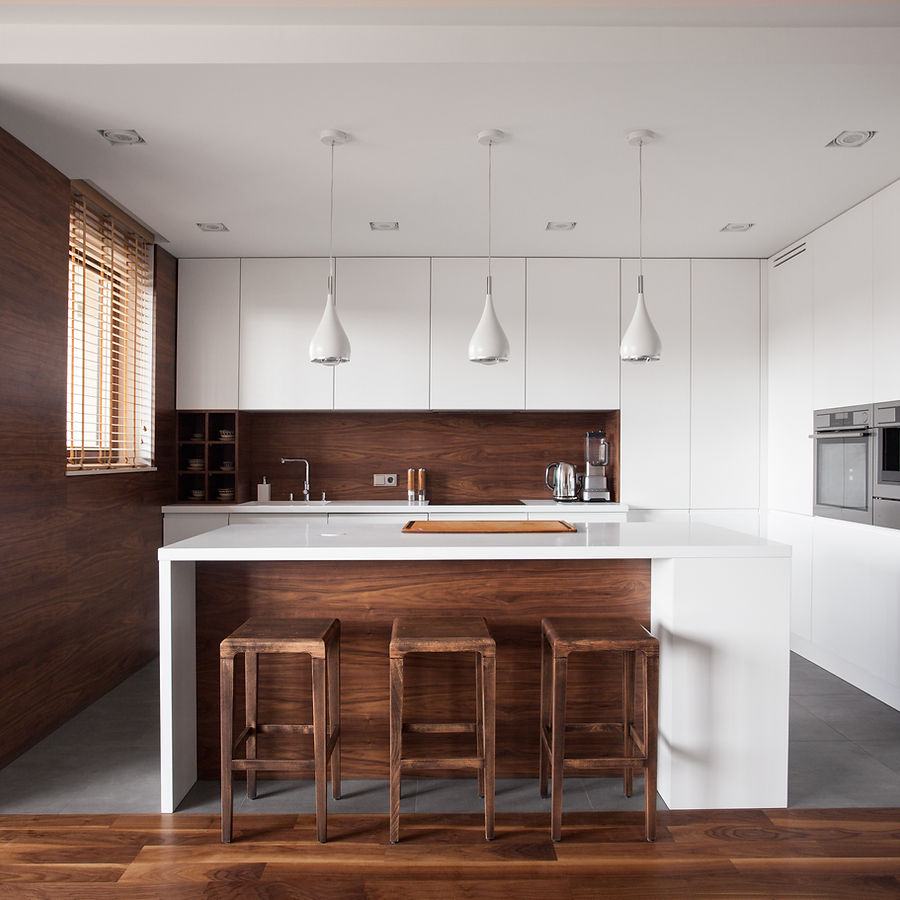 Premium kitchen with central island in a custom home built by Berm Inc.